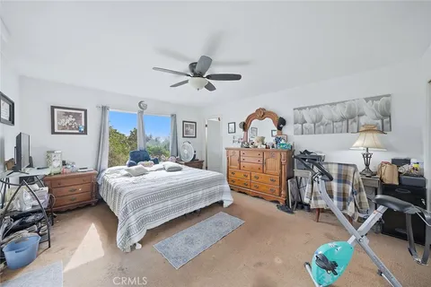 a living room with furniture toys and a kitchen view