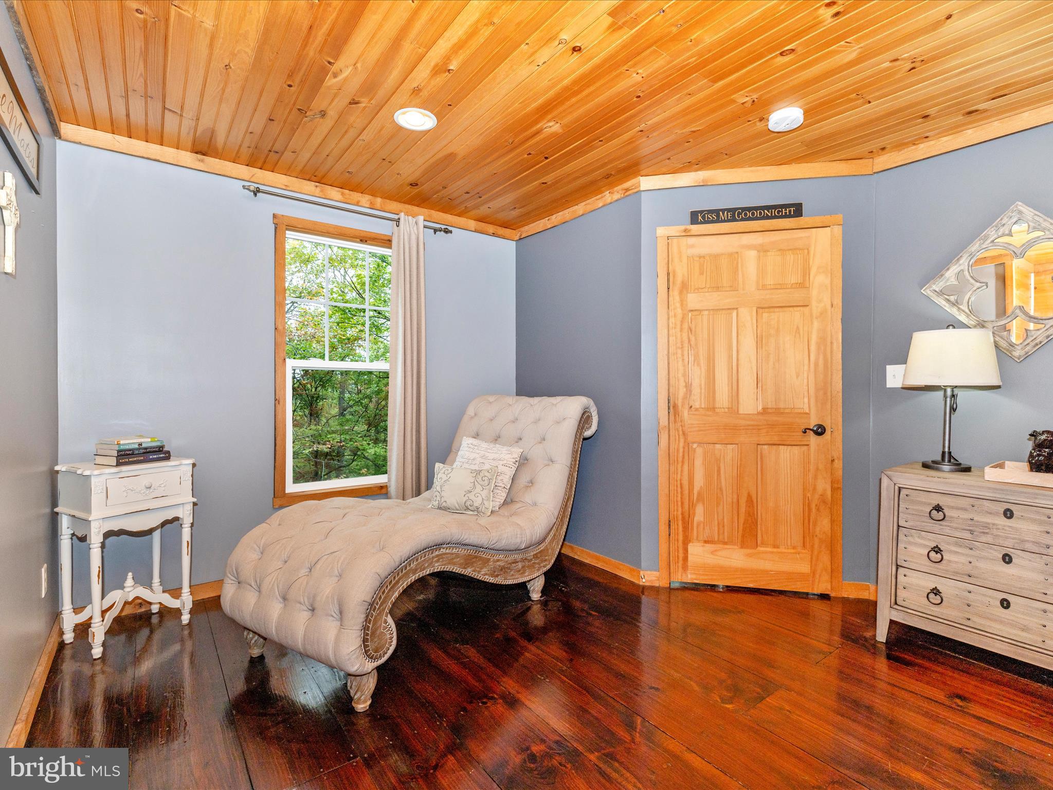 8935 Hawbottom Road Middletown, MD 21769 - Photo 27 of 84 a bedroom with a bed and a chair with the wooden floor