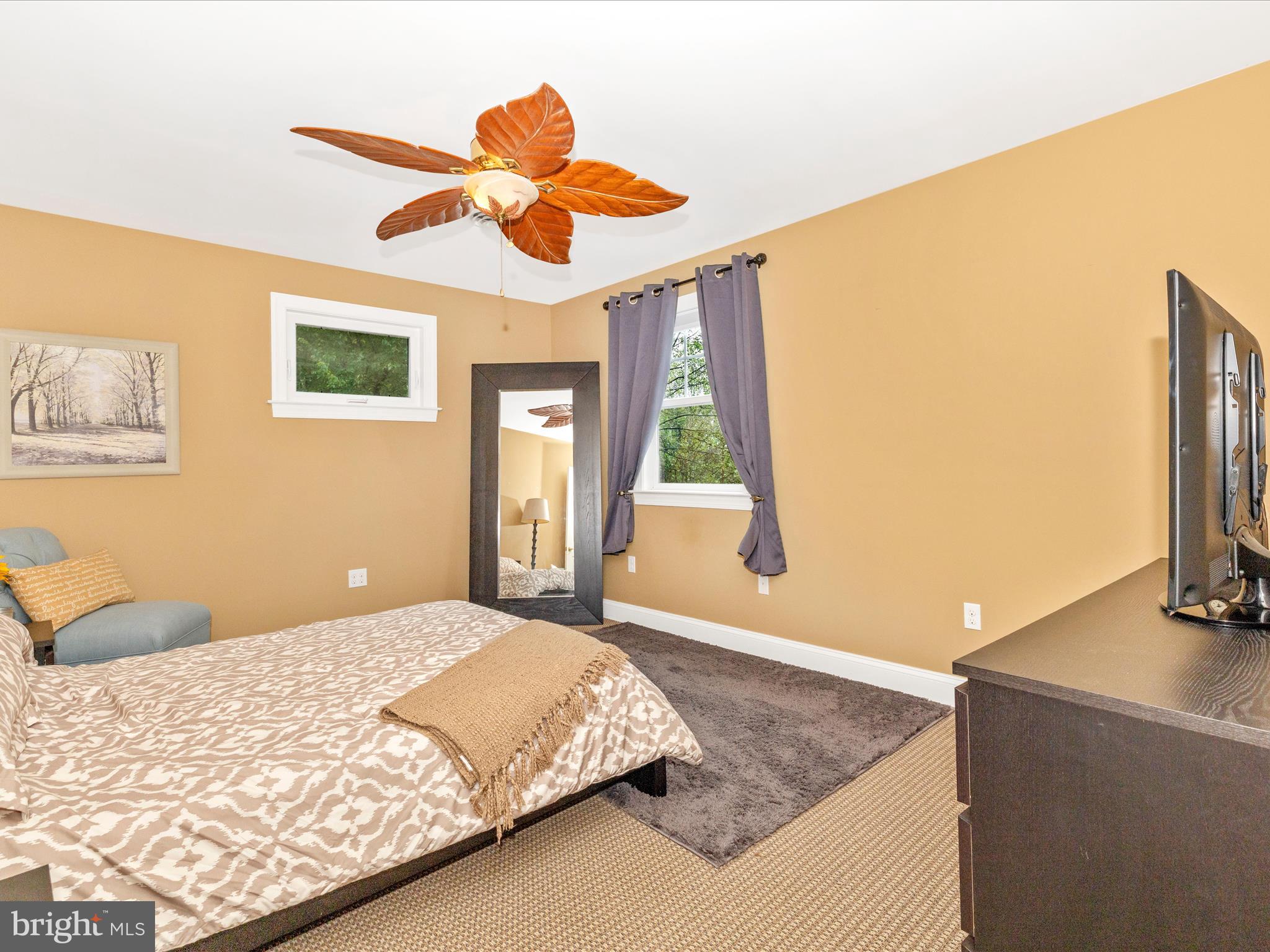 8935 Hawbottom Road Middletown, MD 21769 - Photo 57 of 84 a bedroom with a large bed and a flat screen tv