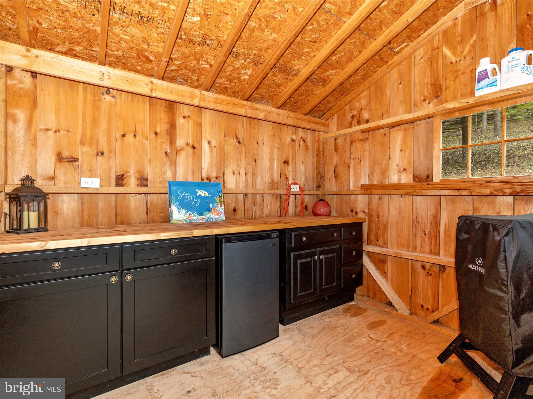 8935 Hawbottom Road Middletown, MD 21769 - Photo 71 of 84 a kitchen with a sink and wooden cabinets