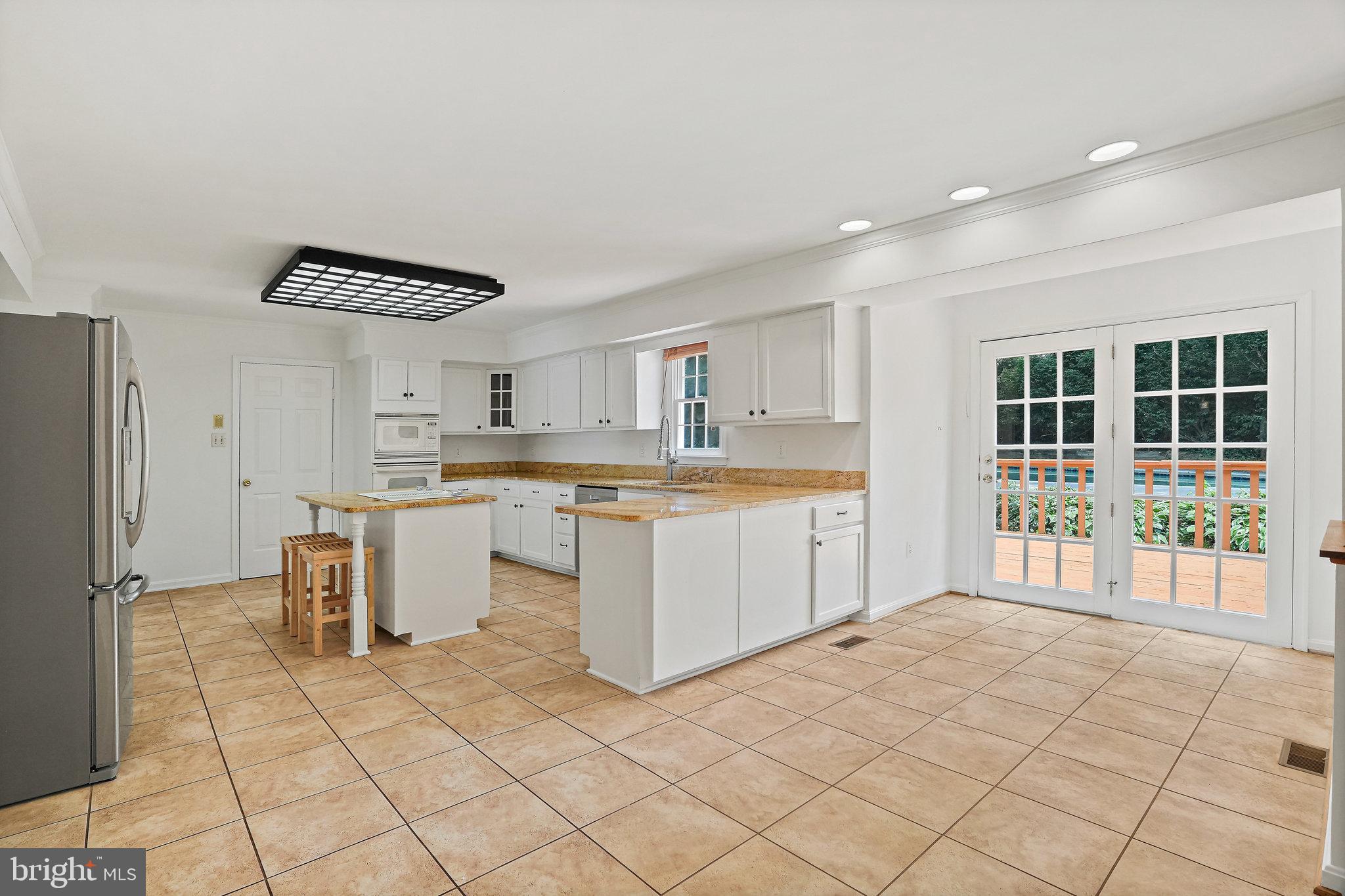 15515 Langside Street Silver Spring, MD 20905 - Photo 12 of 38 Kitchen with access to Deck and Pool