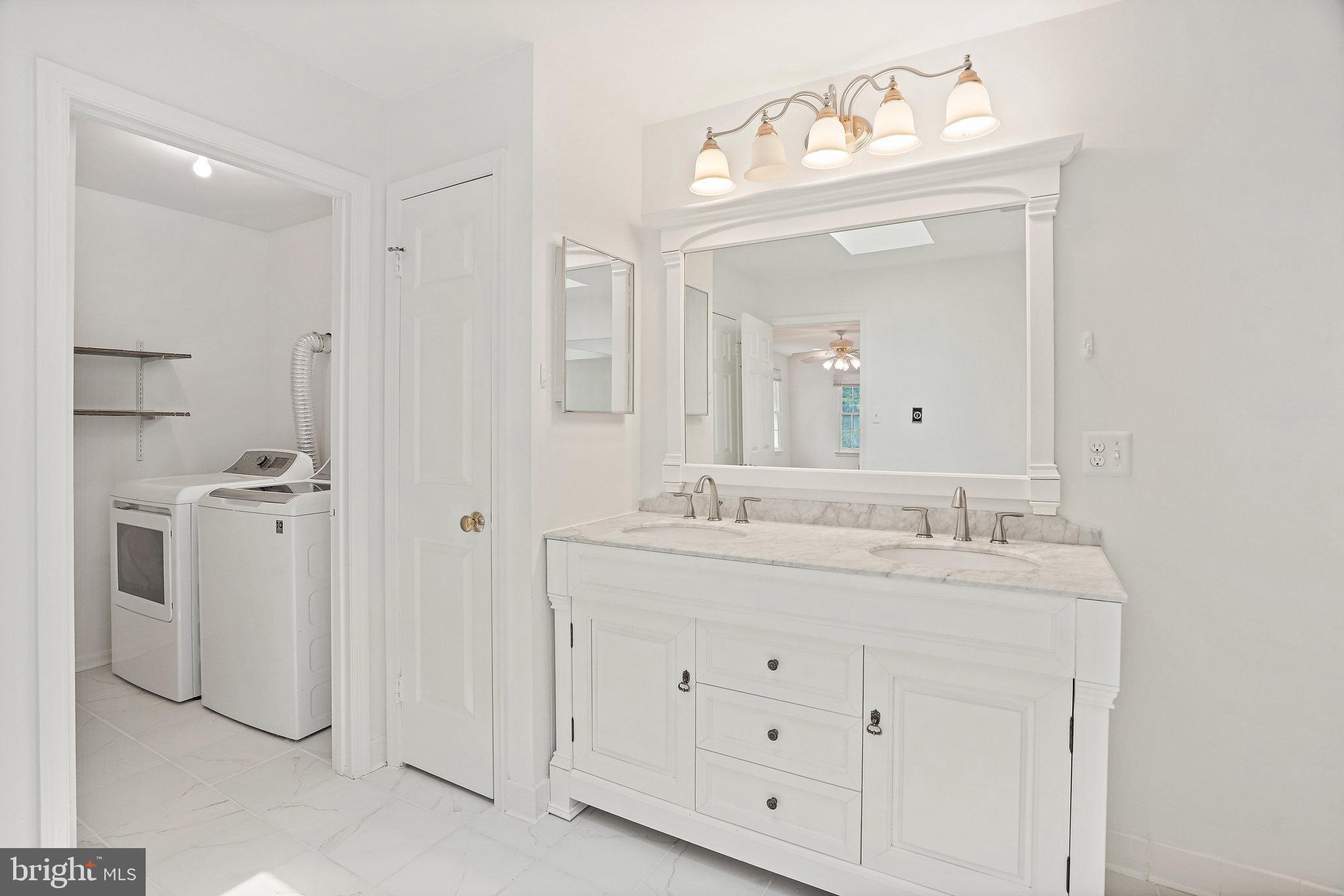 15515 Langside Street Silver Spring, MD 20905 - Photo 25 of 38 Primary Bathroom with Washer & Dryer Access