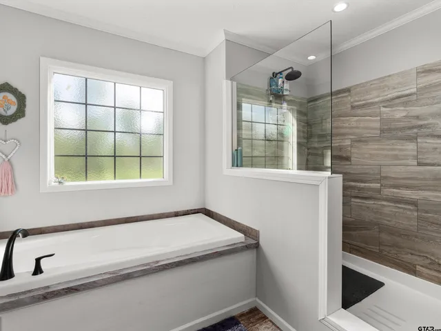 a bathroom with a bathtub and window