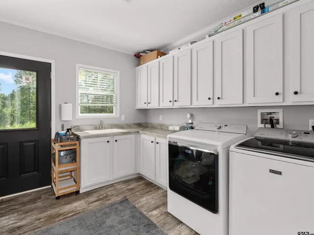 a view of a kitchen with washer and dryer