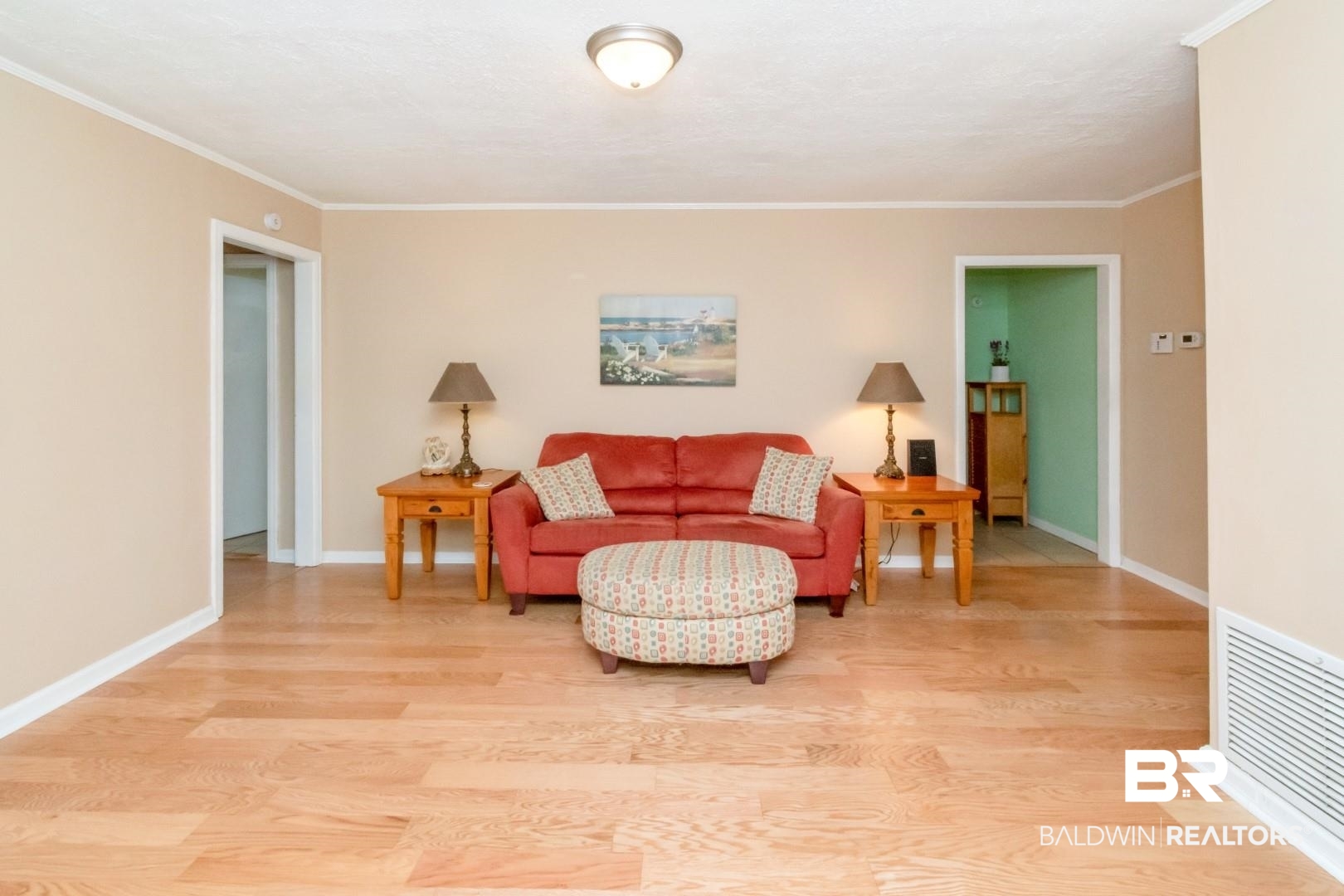1321 Rainbow Drive West Mobile, AL 36693 - Photo 7 of 48 Living room featuring crown molding and hardwood / wood-style floors