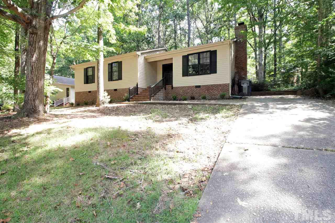 7420 Post Oak Road Raleigh, NC 27615 - Photo 2 of 22 a front view of a house with garden