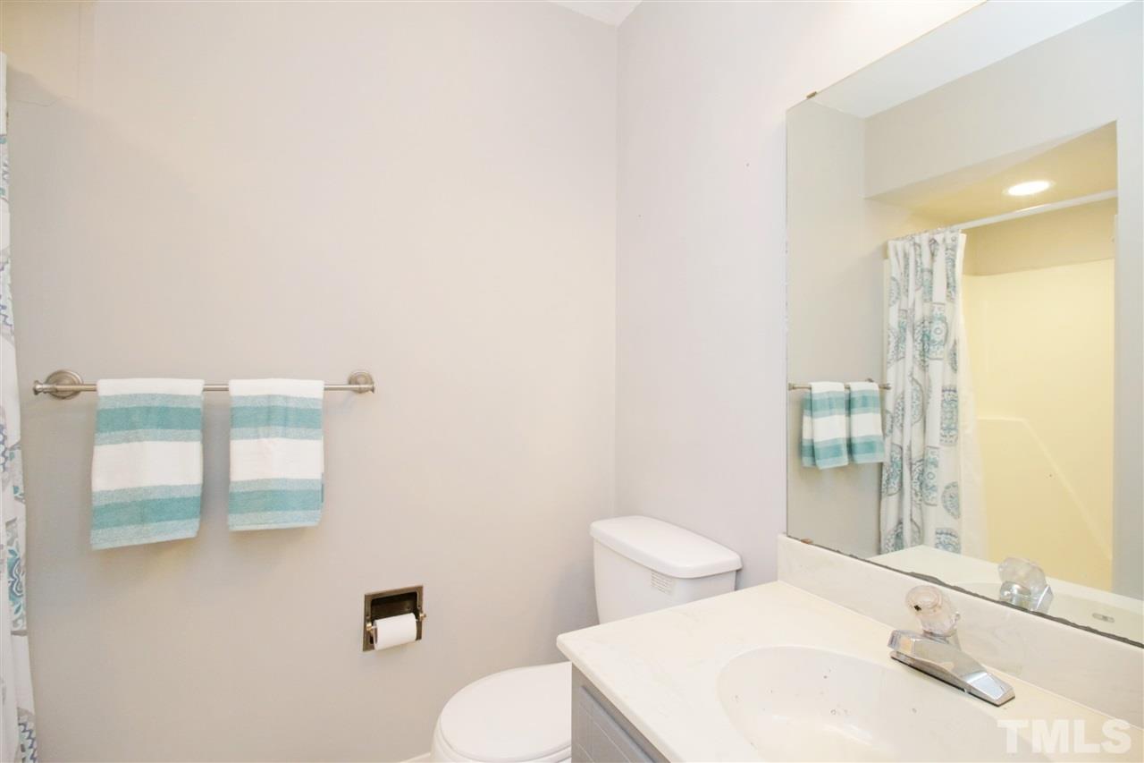 7420 Post Oak Road Raleigh, NC 27615 - Photo 12 of 22 a bathroom with a sink and toilet