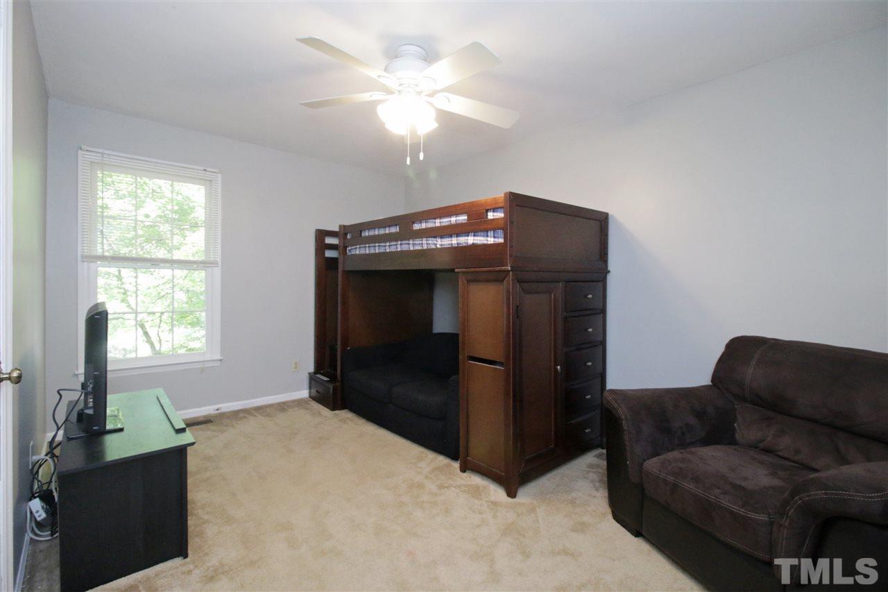 7420 Post Oak Road Raleigh, NC 27615 - Photo 14 of 22 a living room with furniture and a ceiling fan