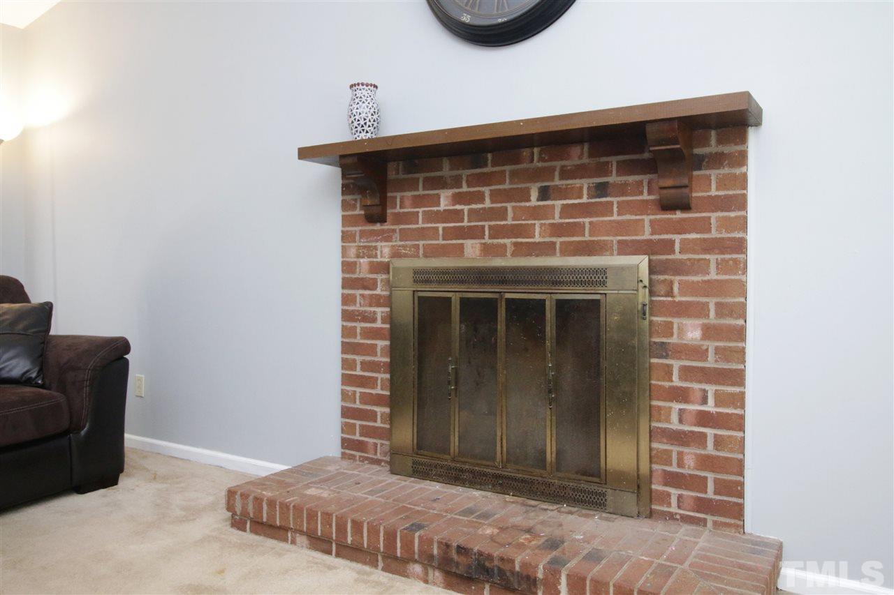 7420 Post Oak Road Raleigh, NC 27615 - Photo 16 of 22 a view of empty room with a fireplace