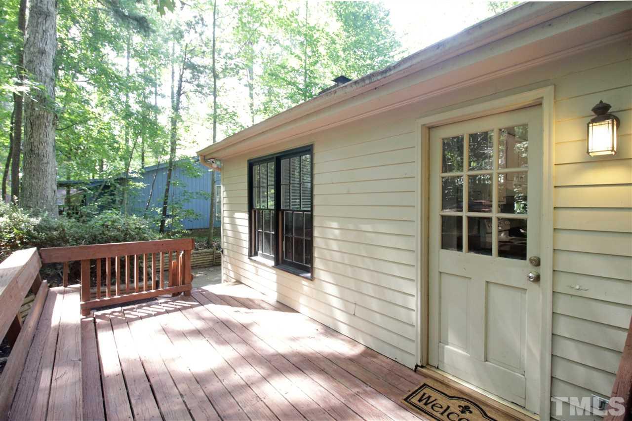 7420 Post Oak Road Raleigh, NC 27615 - Photo 18 of 22 a view of a house with backyard and sitting area