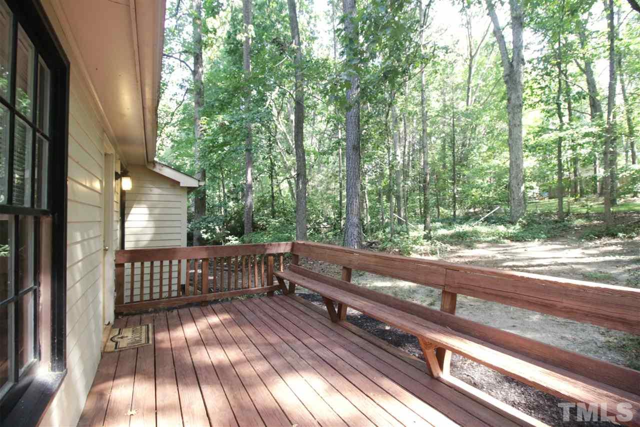 7420 Post Oak Road Raleigh, NC 27615 - Photo 19 of 22 a view of backyard with deck and wooden floor