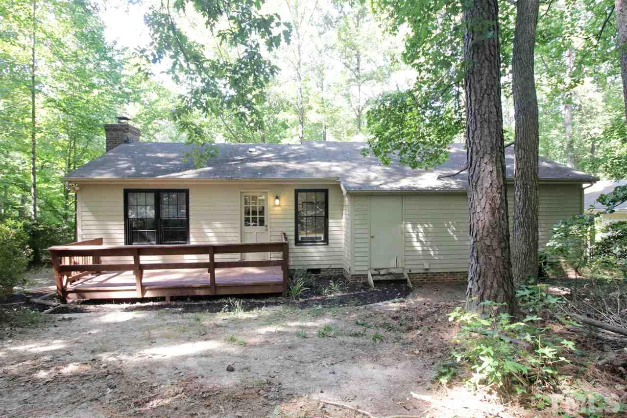 7420 Post Oak Road Raleigh, NC 27615 - Photo 20 of 22 a front view of a house with garden