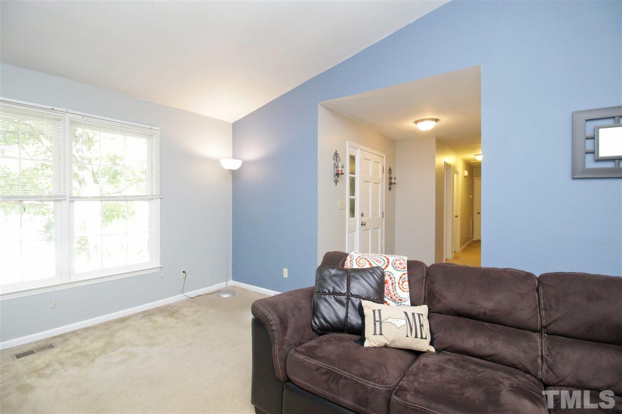7420 Post Oak Road Raleigh, NC 27615 - Photo 7 of 22 a living room with furniture and a large window