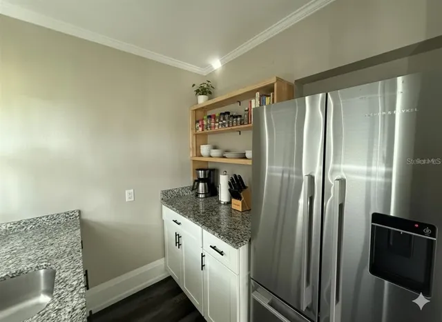 a kitchen with a sink and a stove