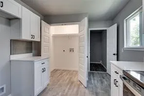 a view of a kitchen from the hallway