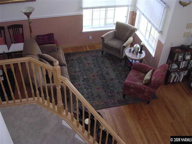 1499 Backer Way Reno, NV 89523 - Photo 3 of 9 a living room with furniture and stairs