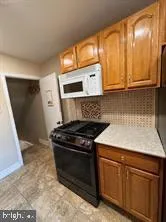 a kitchen with a stove and a sink