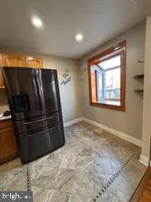 a view of wooden floor and windows in a room