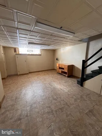 a white toilet sitting next to a bathroom sink