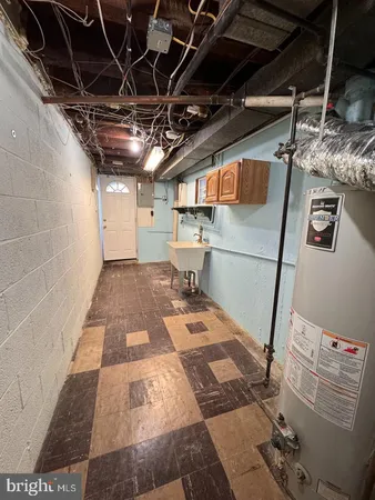 a brick building with a bench in front of it