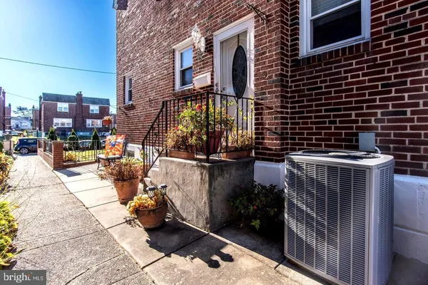 a view of a patio with a table and chairs