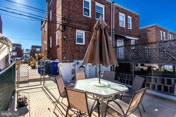 a view of a house with brick walls