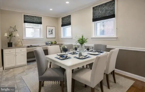 a view of a dining room with furniture and window