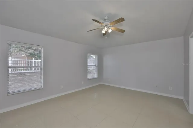 a view of an empty room with a window