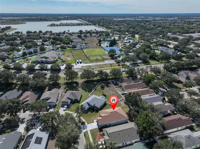 an aerial view of residential houses with outdoor space