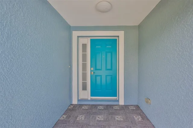 a view of a hallway with wooden door