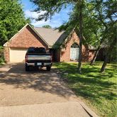 a house view with a garden space