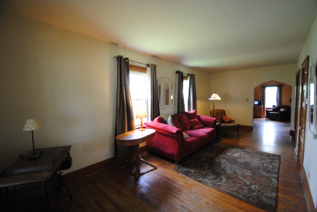 1120 Ridgeway Avenue Aurora, IL 60506 - Photo 6 of 16 a living room with furniture and wooden floor