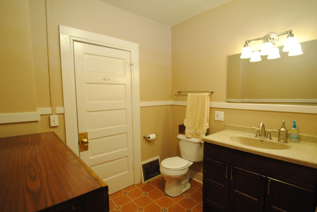 1120 Ridgeway Avenue Aurora, IL 60506 - Photo 8 of 16 a bathroom with a sink a toilet and shower