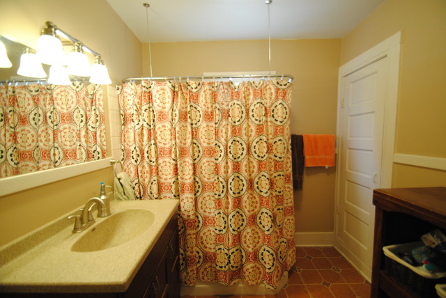 1120 Ridgeway Avenue Aurora, IL 60506 - Photo 9 of 16 a bathroom with a sink and a tub