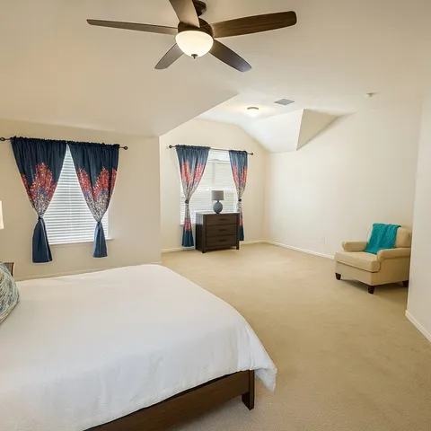 a bedroom with a bed and window