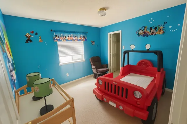 a bedroom with a bed and window