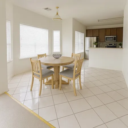 a view of a dining room with furniture