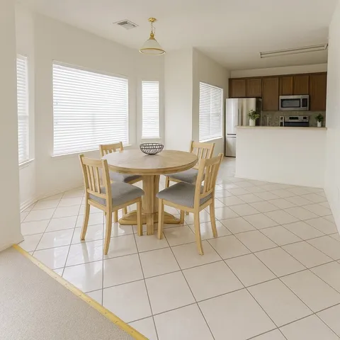 a view of a dining room with furniture