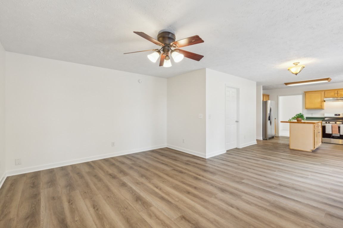 1948 Portway Road Spring Hill, TN 37174 - Photo 13 of 28 a view of an empty room with window and wooden floor