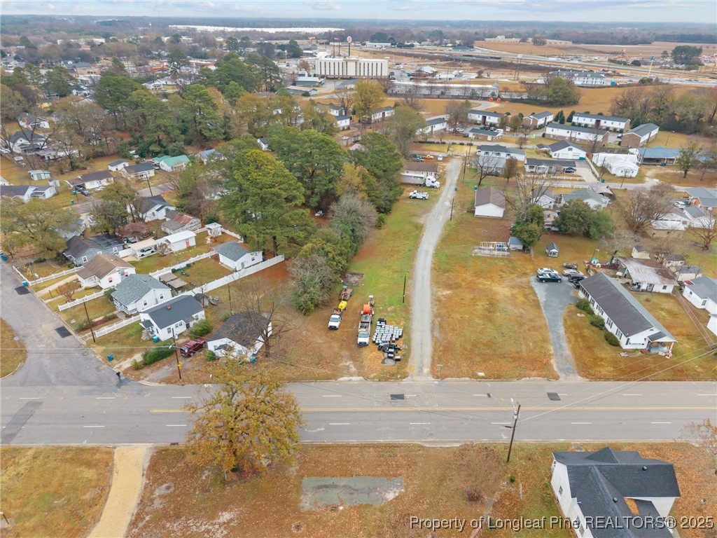 123-125 Spring Branch Road Dunn, NC 28334 - Photo 8 of 16 an aerial view of residential houses with outdoor space