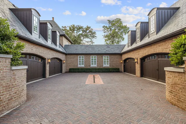 a kitchen with stainless steel appliances granite countertop a sink a stove and a wooden cabinets