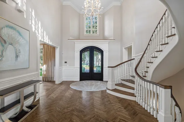 a dining room with furniture a fireplace and chandelier