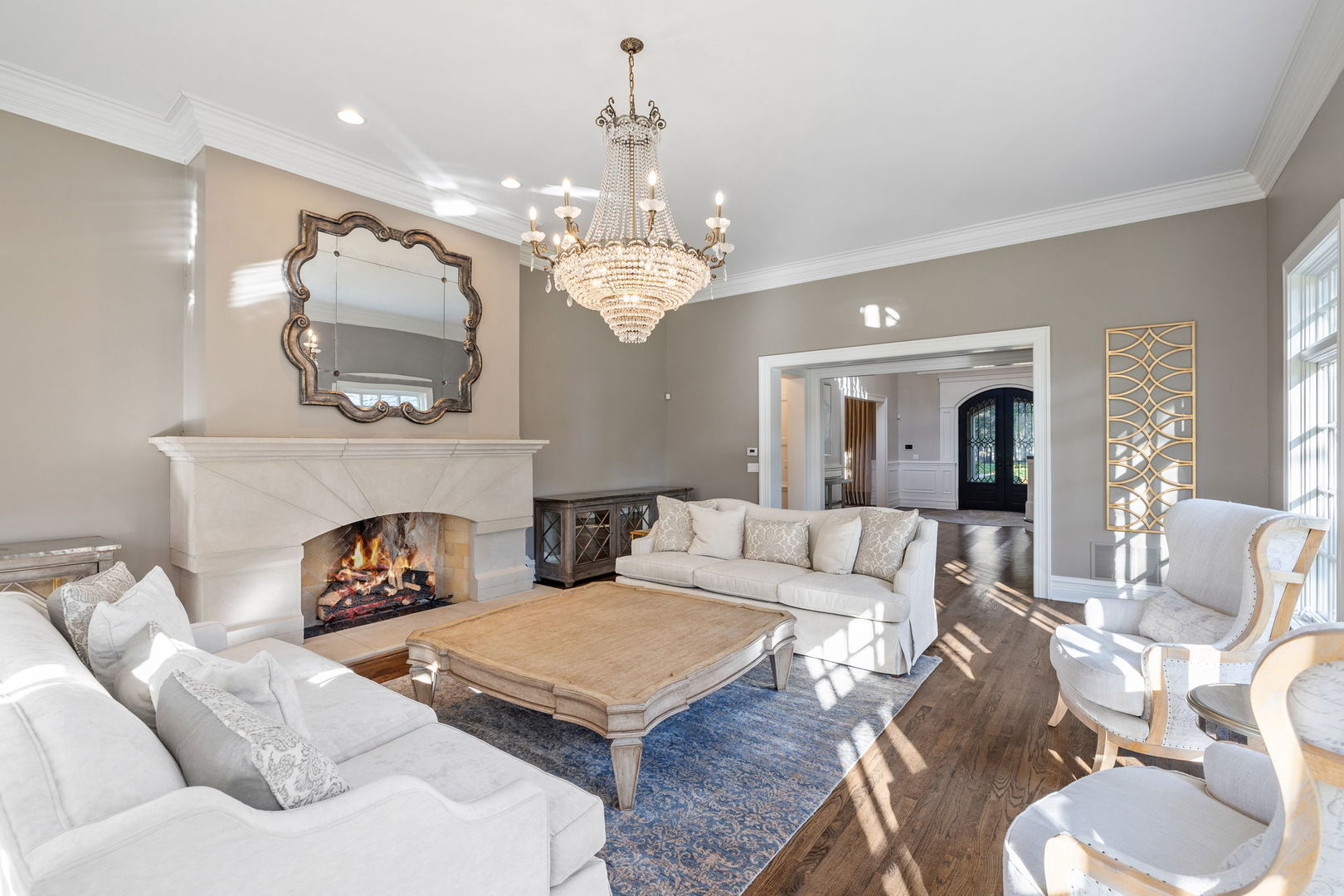 5021 Minkler Road Yorkville, IL 60560 - Photo 25 of 92 a living room with furniture a fireplace and a chandelier