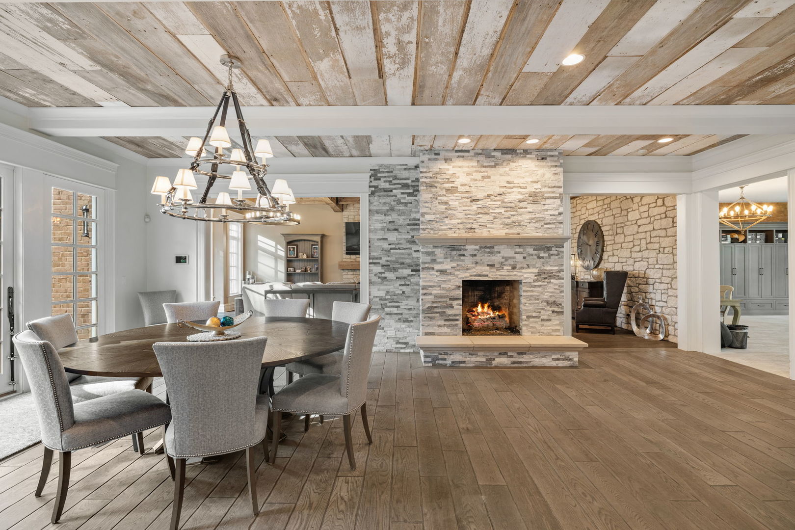 5021 Minkler Road Yorkville, IL 60560 - Photo 36 of 92 a dining room with furniture a fireplace and chandelier