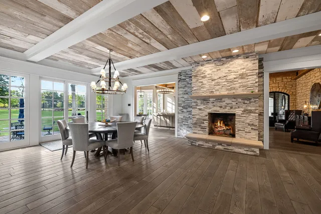a living room with a couch and a wooden floor