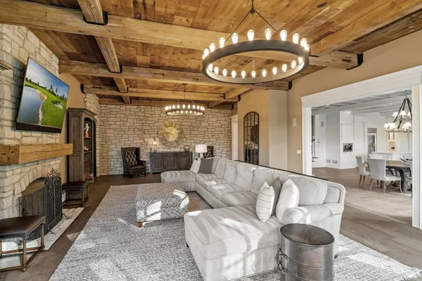 a view of a livingroom with furniture wooden floor and front door