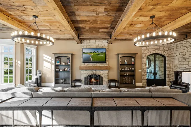 a view of a house with swimming pool and sitting area