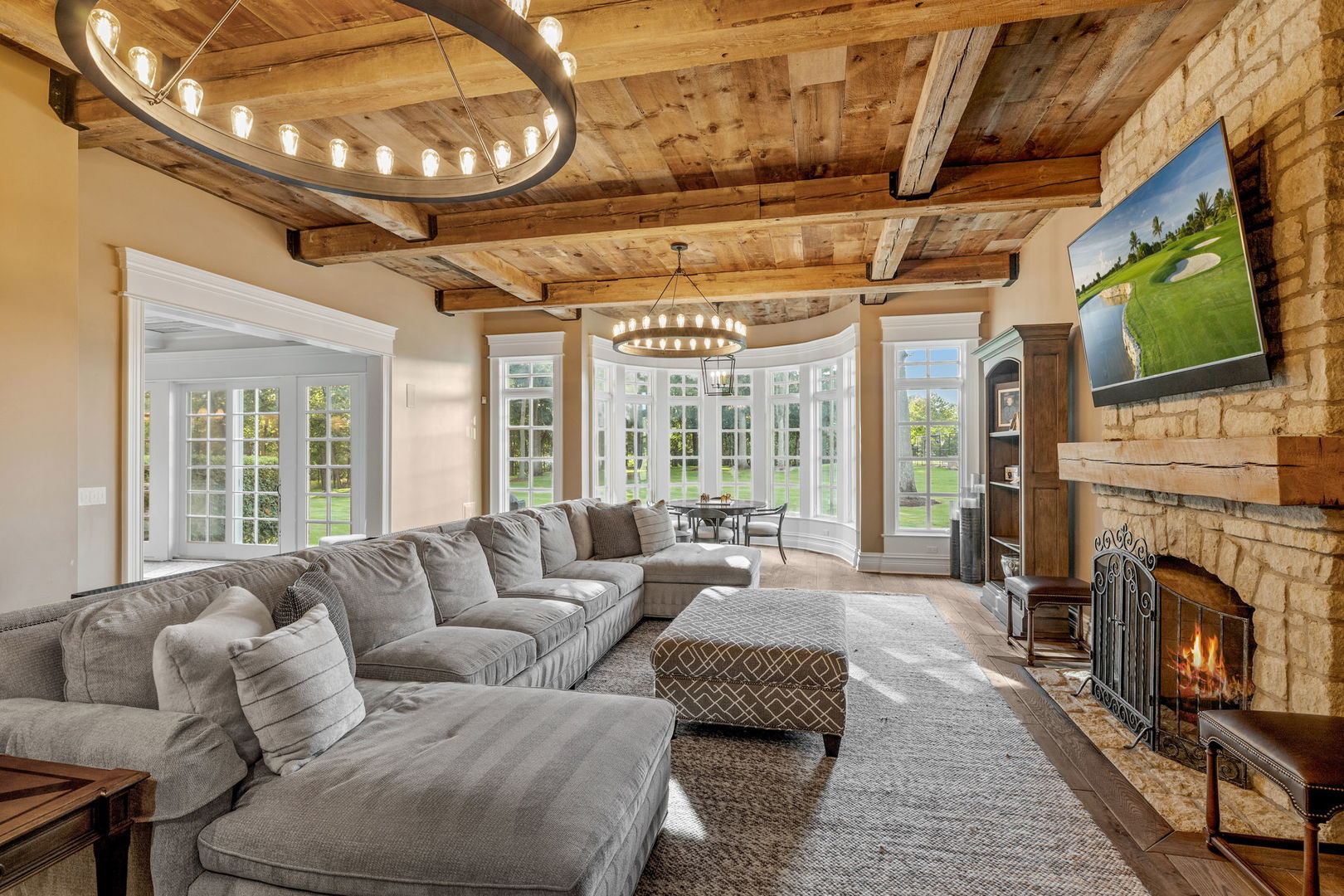 5021 Minkler Road Yorkville, IL 60560 - Photo 42 of 92 a living room with furniture a fireplace and a flat screen tv