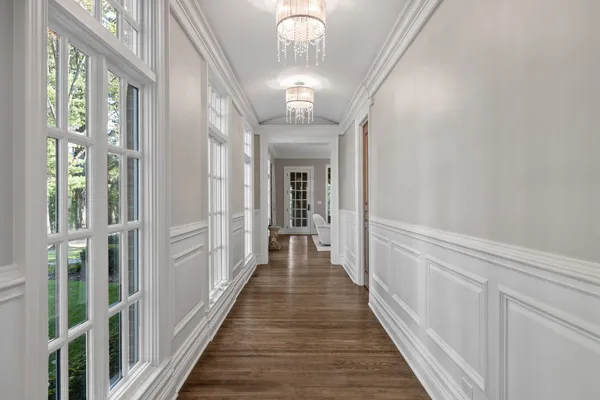 a view of two chairs and table in the patio