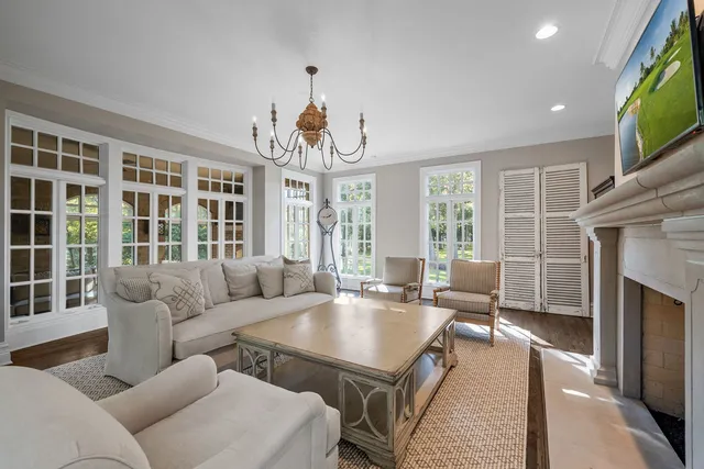 an aerial view of a house with a yard basket ball court and outdoor seating